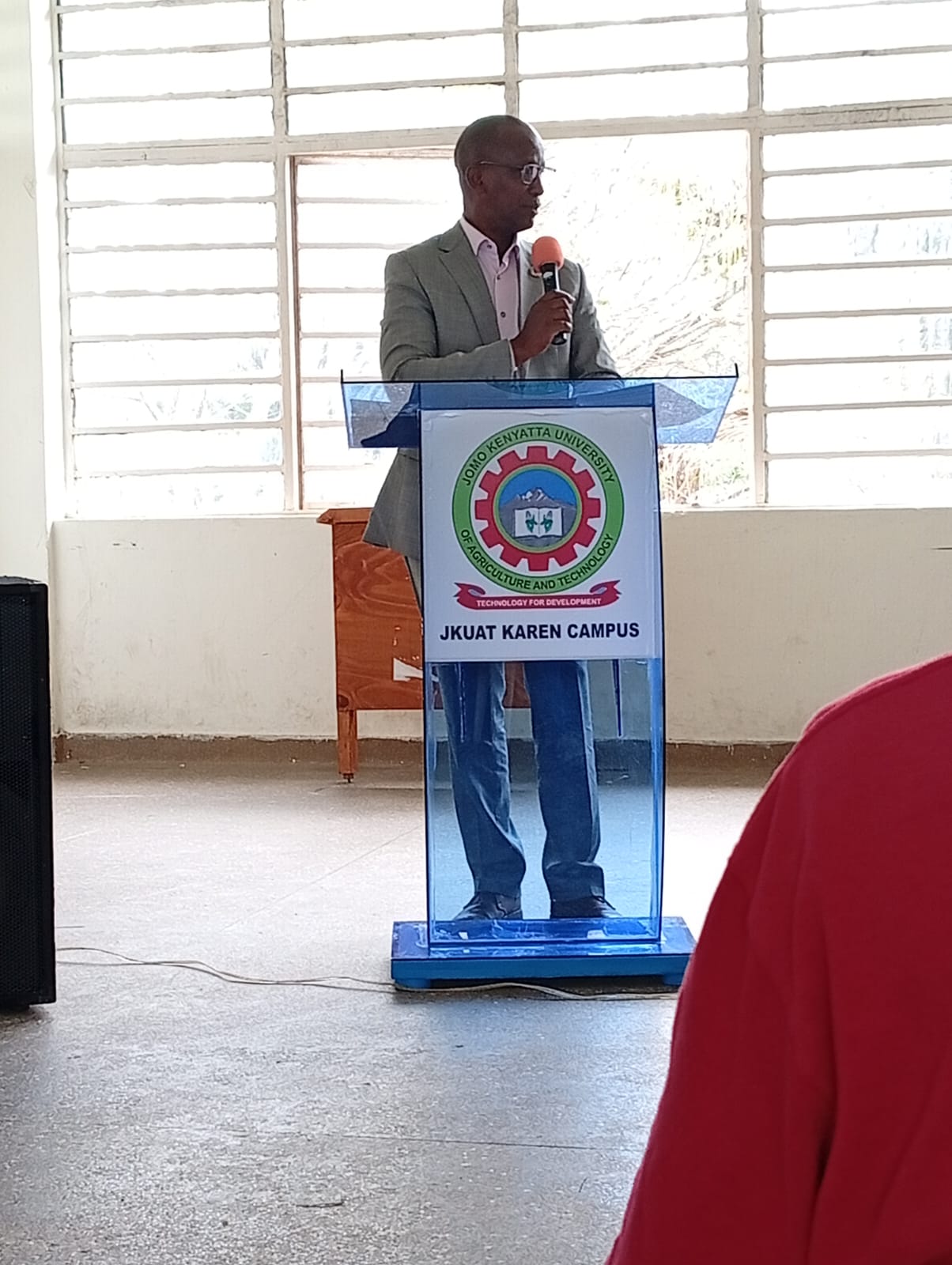 Mr. Paul Mugambi speaking from the podium