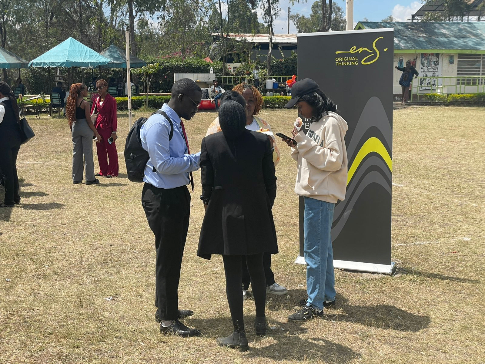 Law students in conversation beside the ENS stand