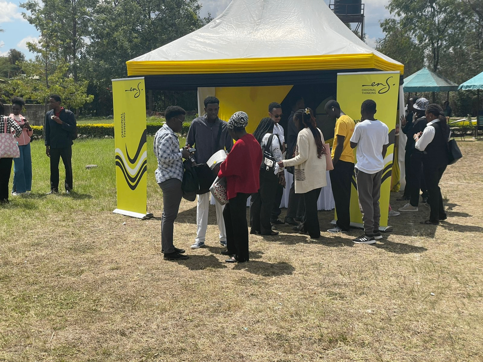 ENS tent with students engaging the firm's representatives