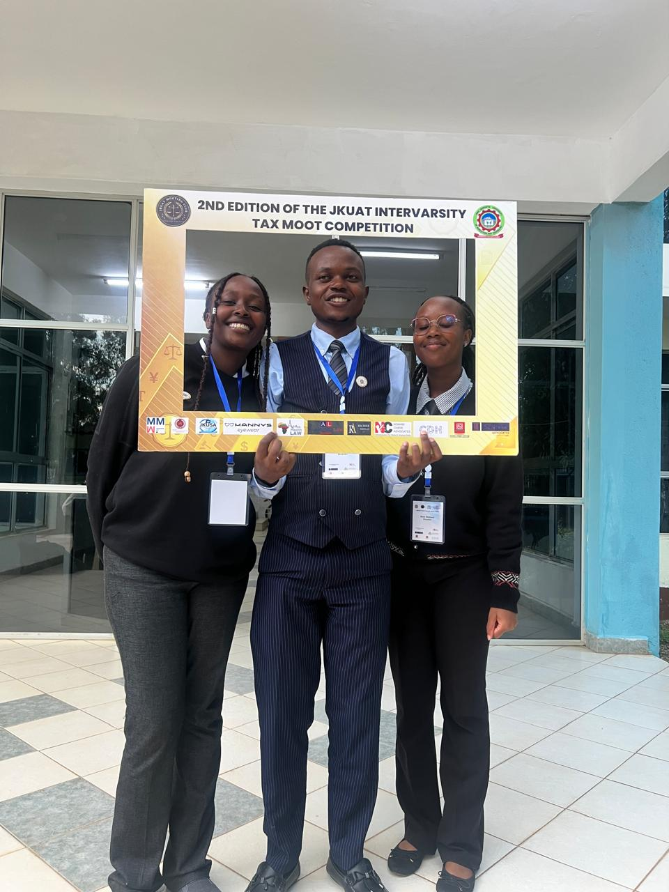 Participants pose with the 2nd Edition Tax Moot commemorative frame