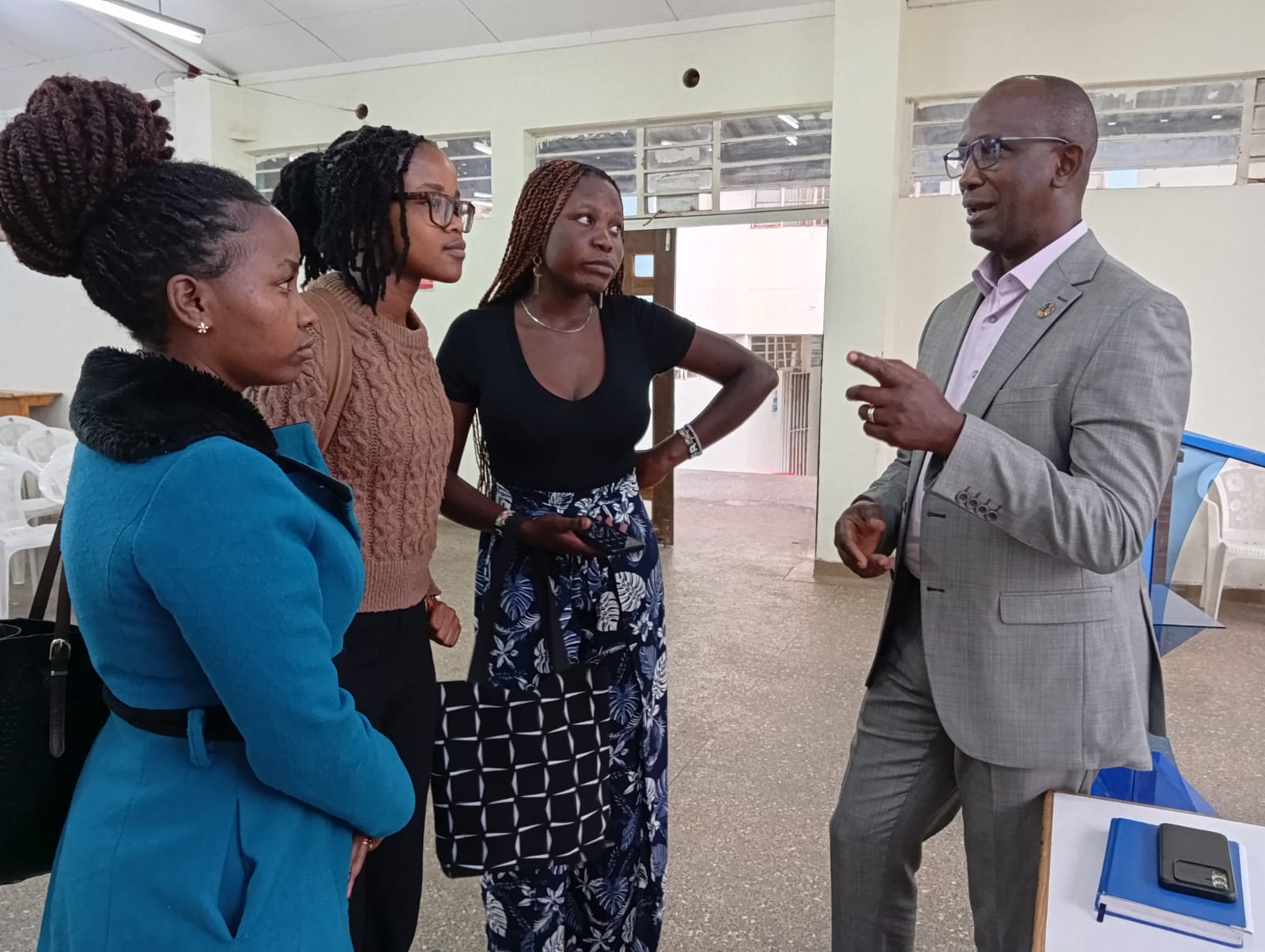 Mr. Paul Mugambi mentoring students a few minutes after the event